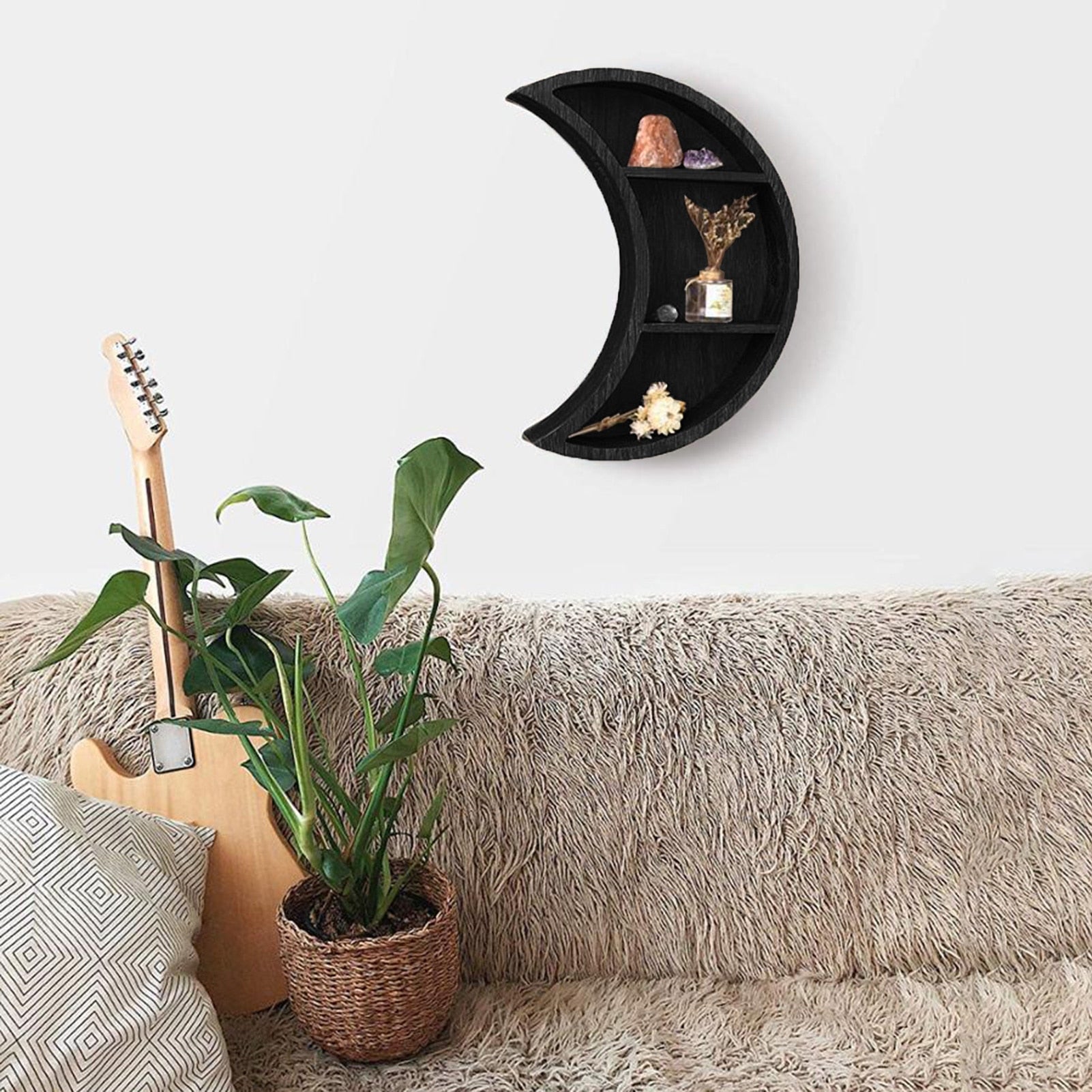 Rustic wooden floating moon-shaped wall-mounted shelf for photos and storage, ideal for space-saving home décor in living rooms and bedrooms.