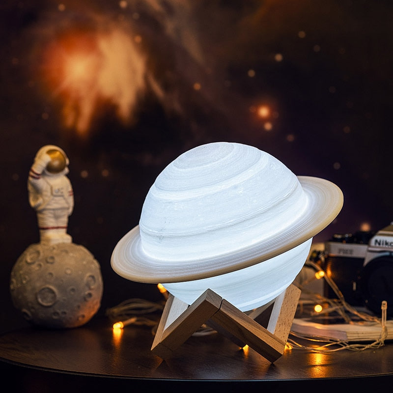 Saturn Lamp: A spherical lamp inspired by the planet Saturn, featuring a textured surface and a ring-like structure.