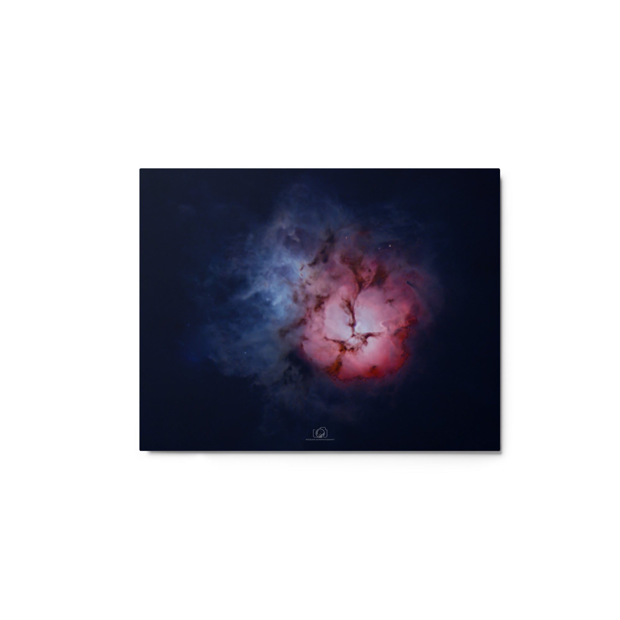 A captivating image of the Trifid Nebula, a stunning celestial formation located in the constellation of Sagittarius. The nebula exhibits a unique trifurcated appearance, with intricate swirls of gas and dust in vibrant shades of red, blue, and pink. This cosmic masterpiece showcases a blend of emission, reflection, and dark nebulae, providing a breathtaking glimpse into the celestial wonders that adorn our universe.