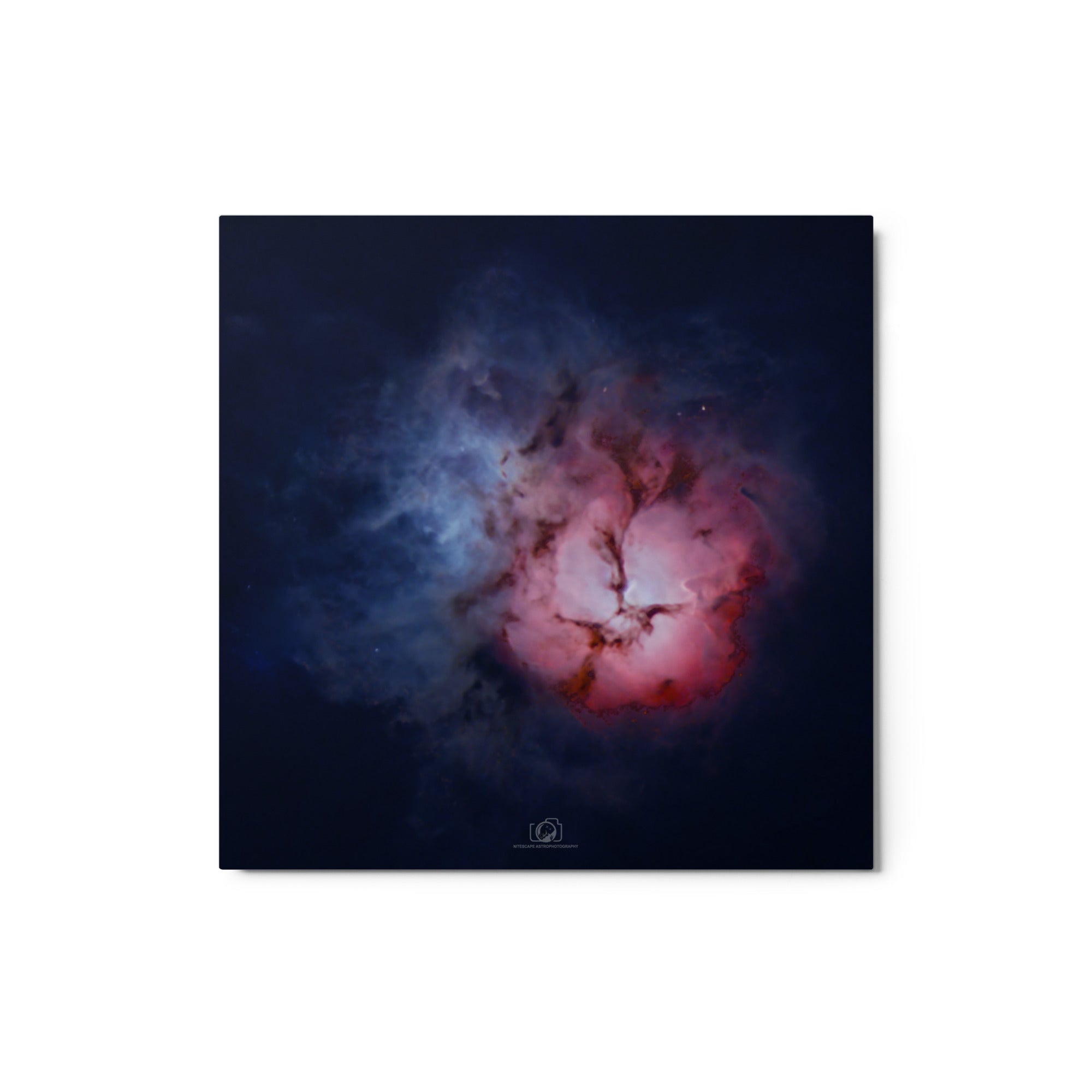 A captivating image of the Trifid Nebula, a stunning celestial formation located in the constellation of Sagittarius. The nebula exhibits a unique trifurcated appearance, with intricate swirls of gas and dust in vibrant shades of red, blue, and pink. This cosmic masterpiece showcases a blend of emission, reflection, and dark nebulae, providing a breathtaking glimpse into the celestial wonders that adorn our universe.