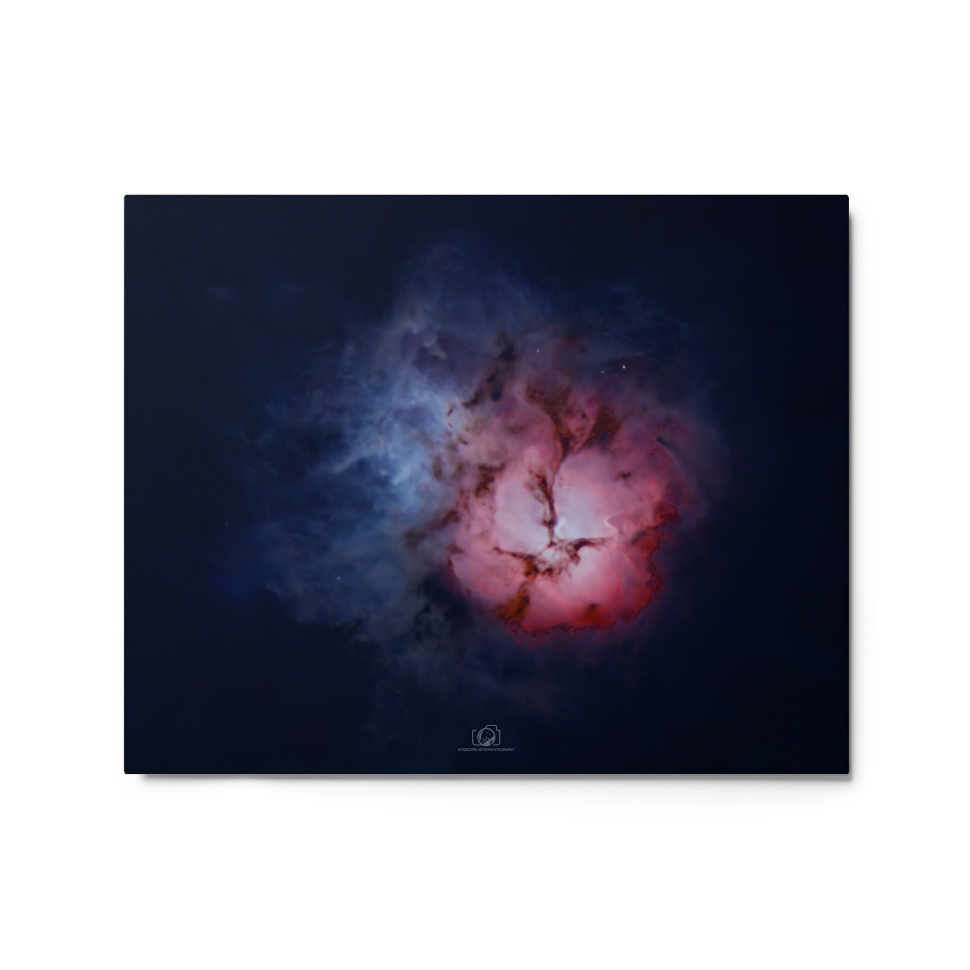 A captivating image of the Trifid Nebula, a stunning celestial formation located in the constellation of Sagittarius. The nebula exhibits a unique trifurcated appearance, with intricate swirls of gas and dust in vibrant shades of red, blue, and pink. This cosmic masterpiece showcases a blend of emission, reflection, and dark nebulae, providing a breathtaking glimpse into the celestial wonders that adorn our universe.