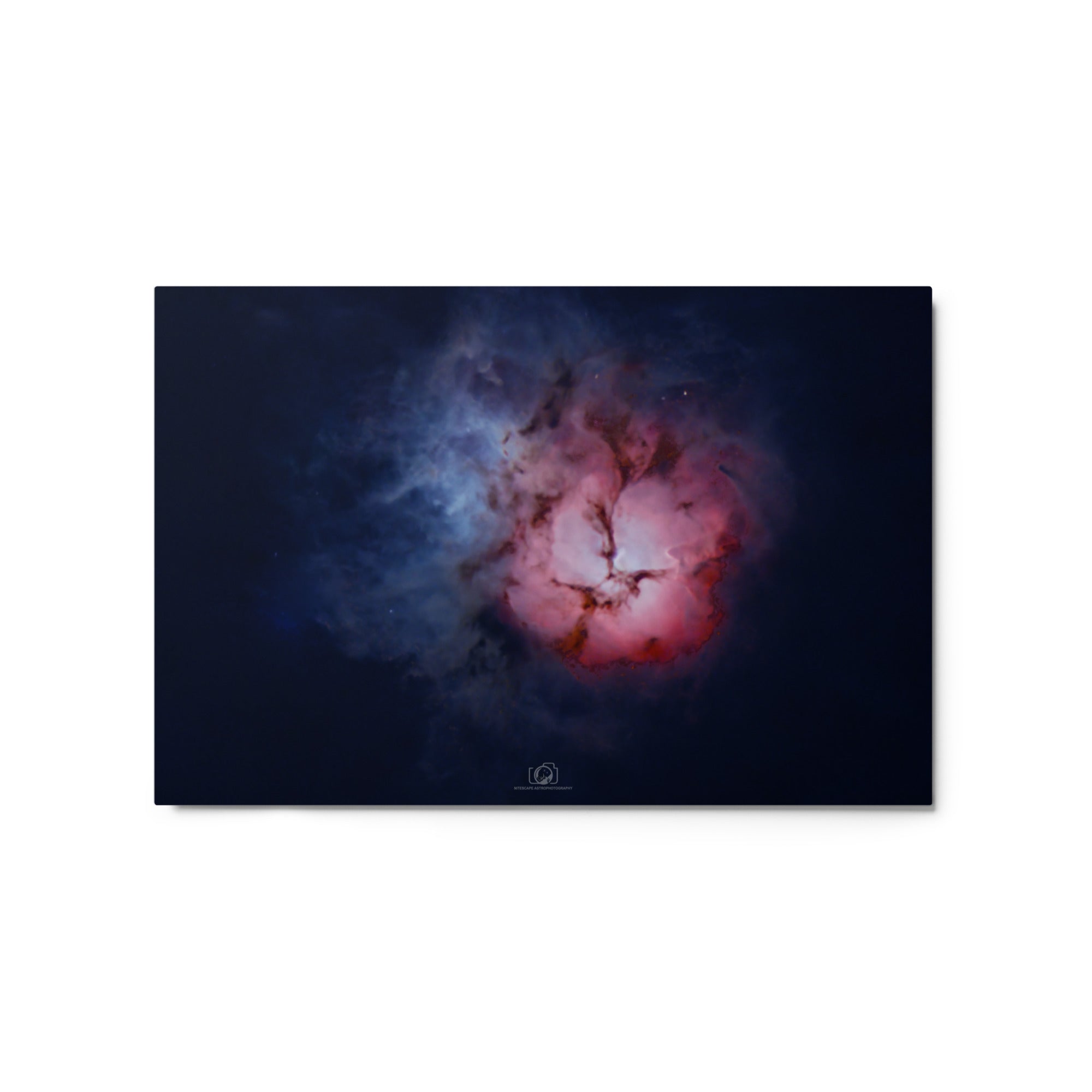 A captivating image of the Trifid Nebula, a stunning celestial formation located in the constellation of Sagittarius. The nebula exhibits a unique trifurcated appearance, with intricate swirls of gas and dust in vibrant shades of red, blue, and pink. This cosmic masterpiece showcases a blend of emission, reflection, and dark nebulae, providing a breathtaking glimpse into the celestial wonders that adorn our universe.