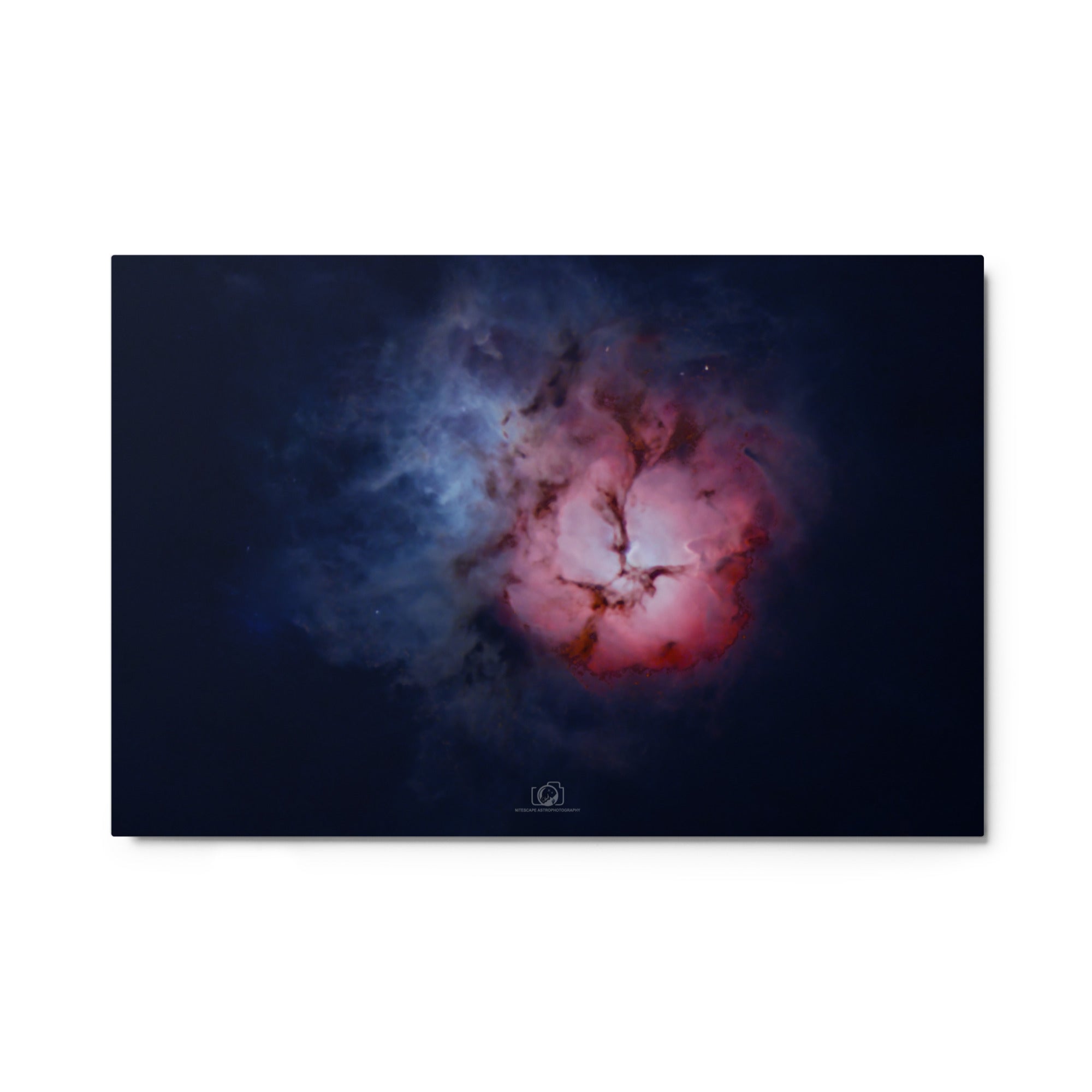A captivating image of the Trifid Nebula, a stunning celestial formation located in the constellation of Sagittarius. The nebula exhibits a unique trifurcated appearance, with intricate swirls of gas and dust in vibrant shades of red, blue, and pink. This cosmic masterpiece showcases a blend of emission, reflection, and dark nebulae, providing a breathtaking glimpse into the celestial wonders that adorn our universe.